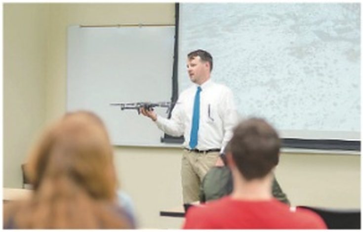 Instructor presenting a drone to students